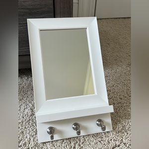 Mirror with hangers